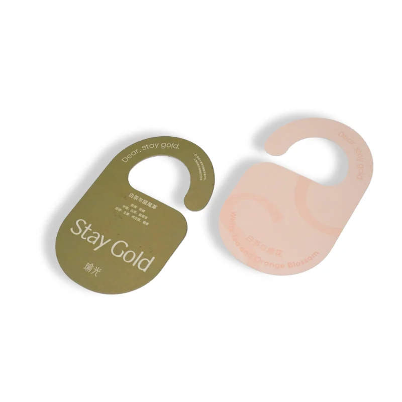 Soft pastel hotel fragrance tag featuring white tea and orange blossom aroma